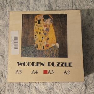 Wooden Puzzle Featuring Gustav Klimt The Kiss Artwork